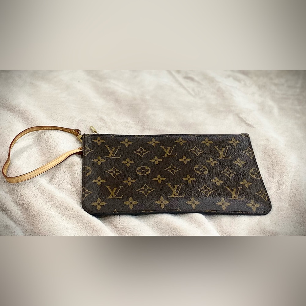 AUTHENTIC Louis Vuitton wristlet.  Hardly used with light pink inside